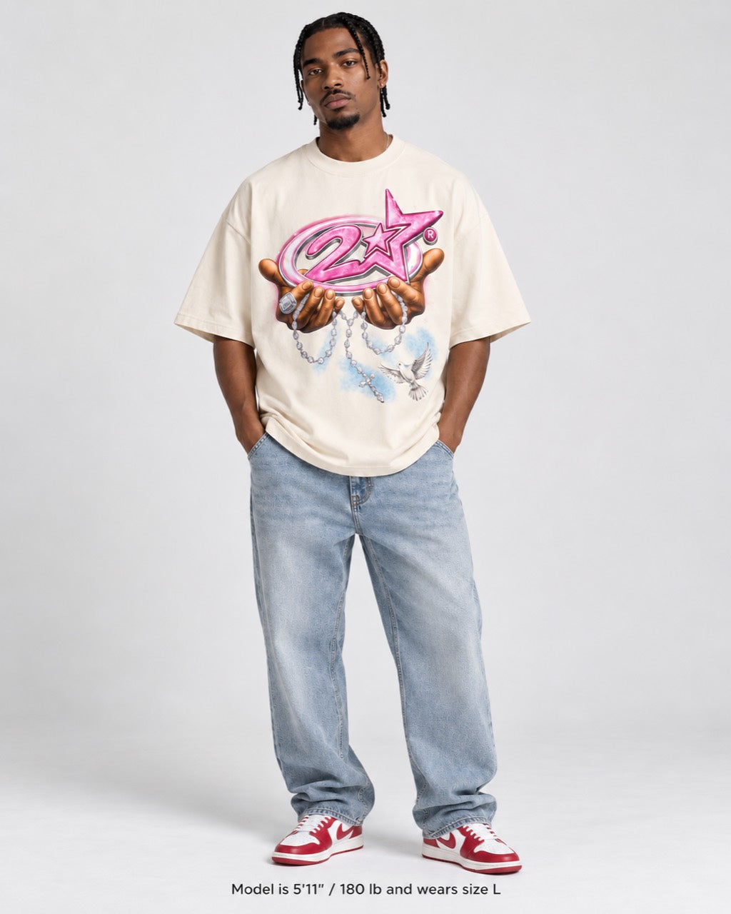 Model wearing the Heaven Sent cream graphic T-shirt